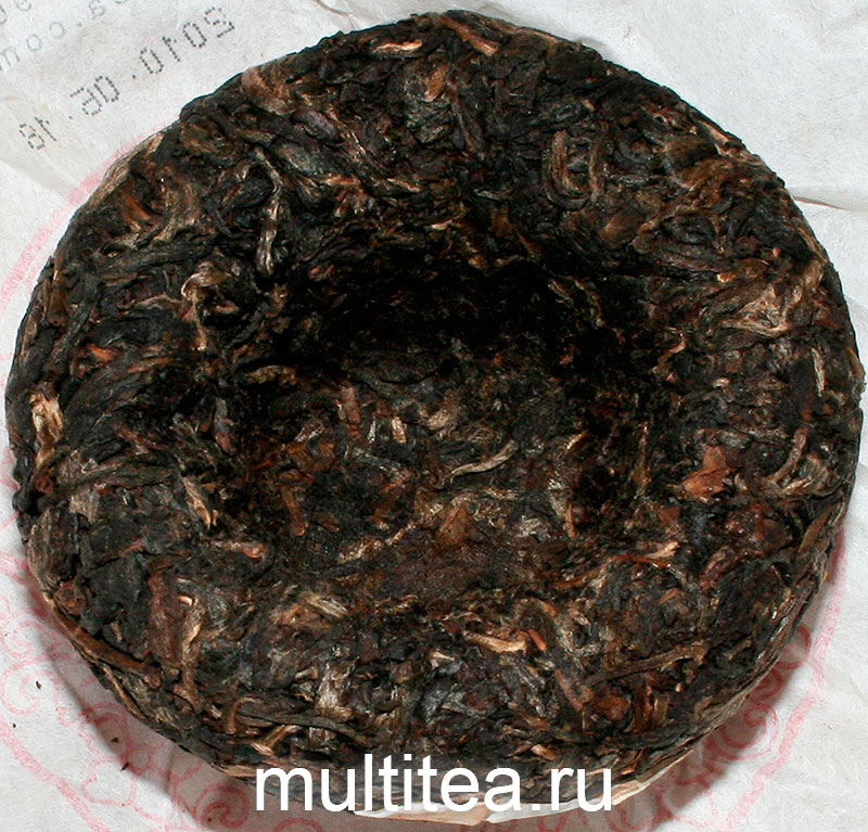 обратная сторона шен пуэра Xiaguan Золотой Цветок 2010 года